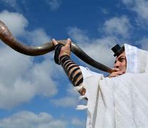 A priest blowing on the Shofar